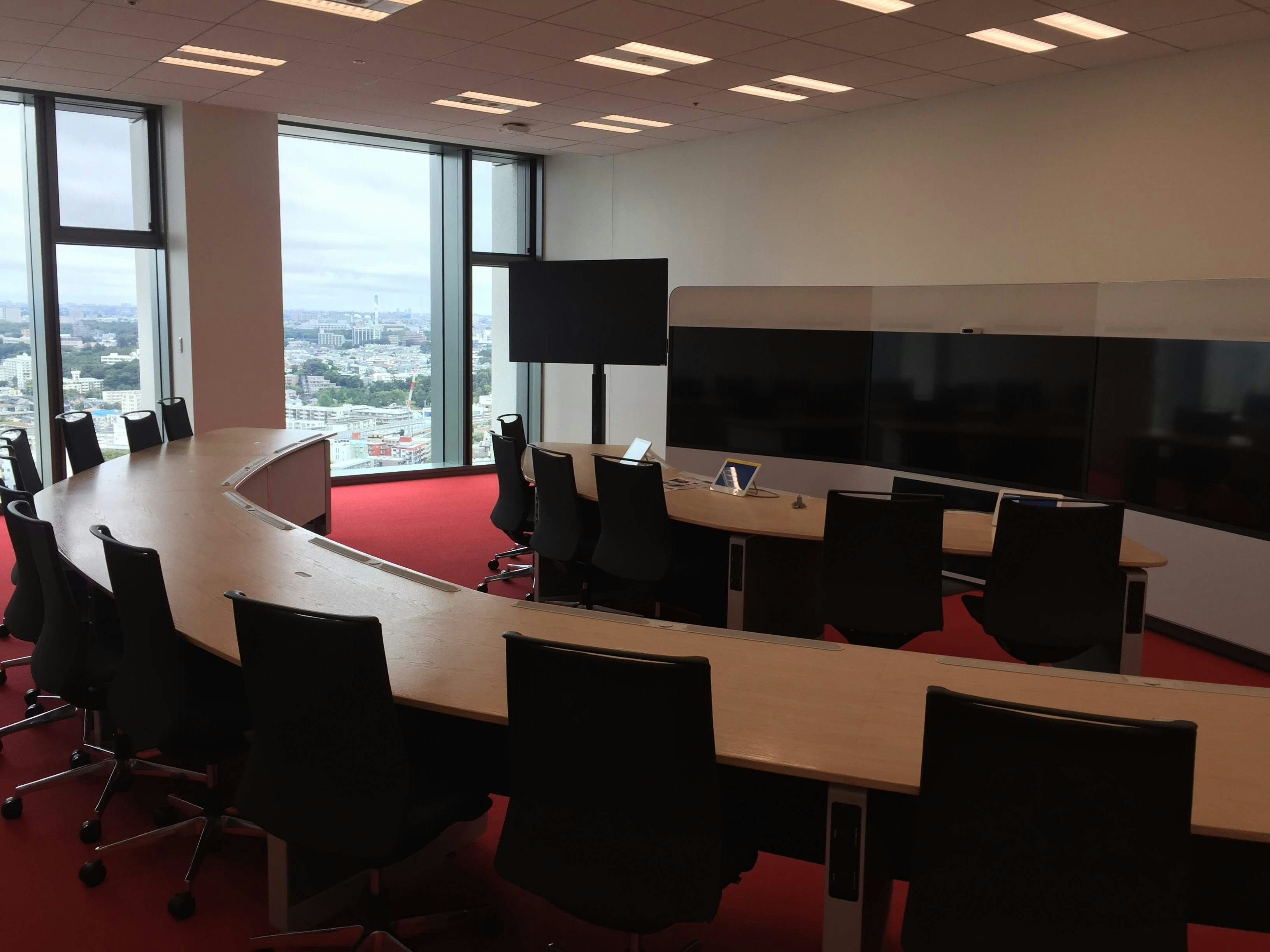 Dark executive boardroom with dramatic shadows, moody atmospheric lighting, deep black walls and corporate steel furniture