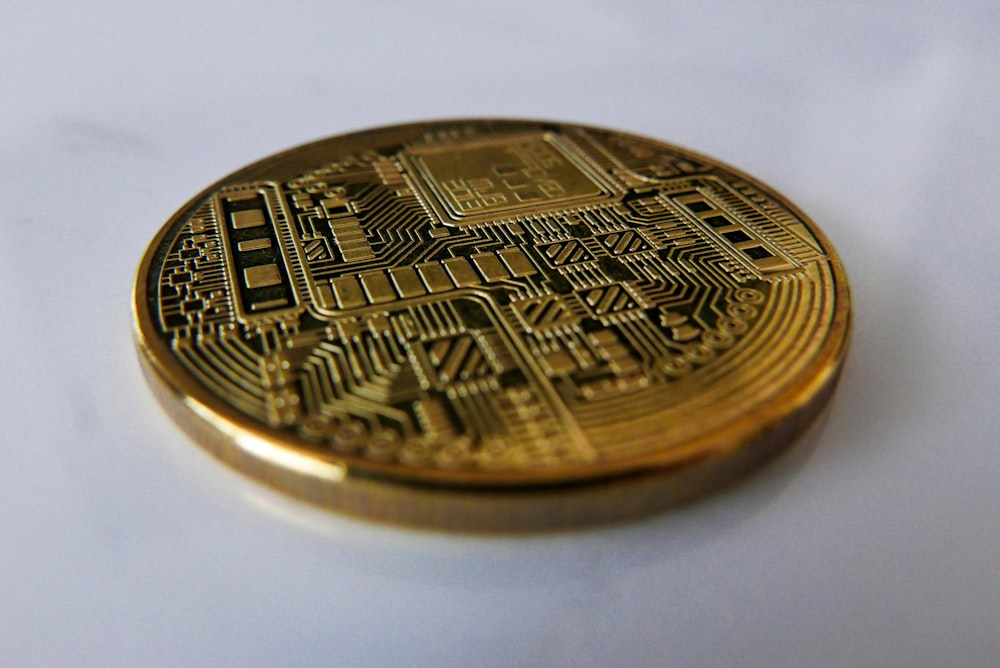 a close up of a coin on a white surface