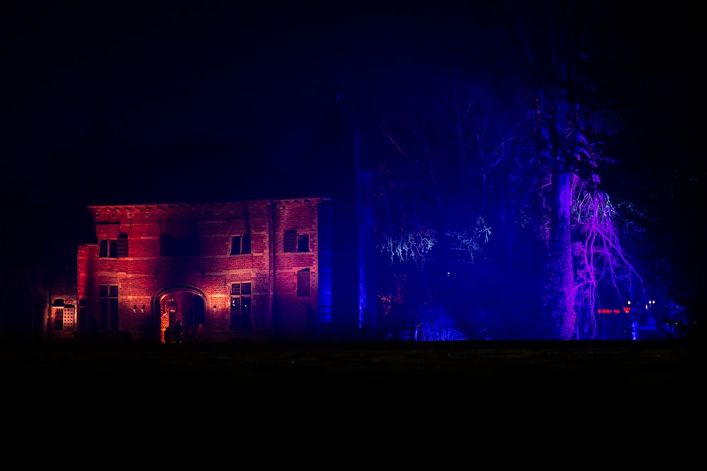 a building lit up with purple and blue lights