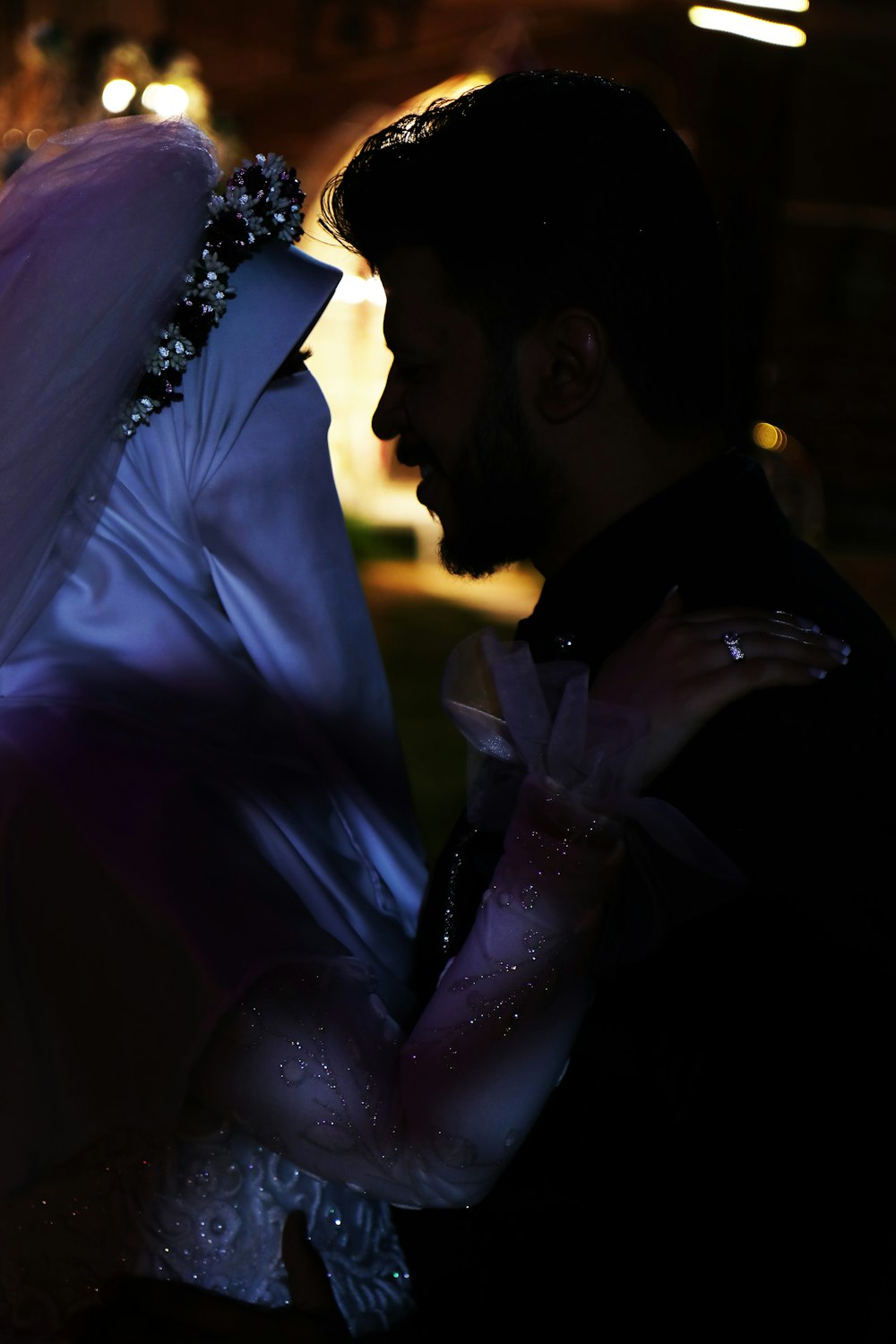 a man and a woman dressed in wedding attire