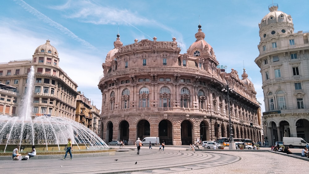 a large building with a fountain in front of it