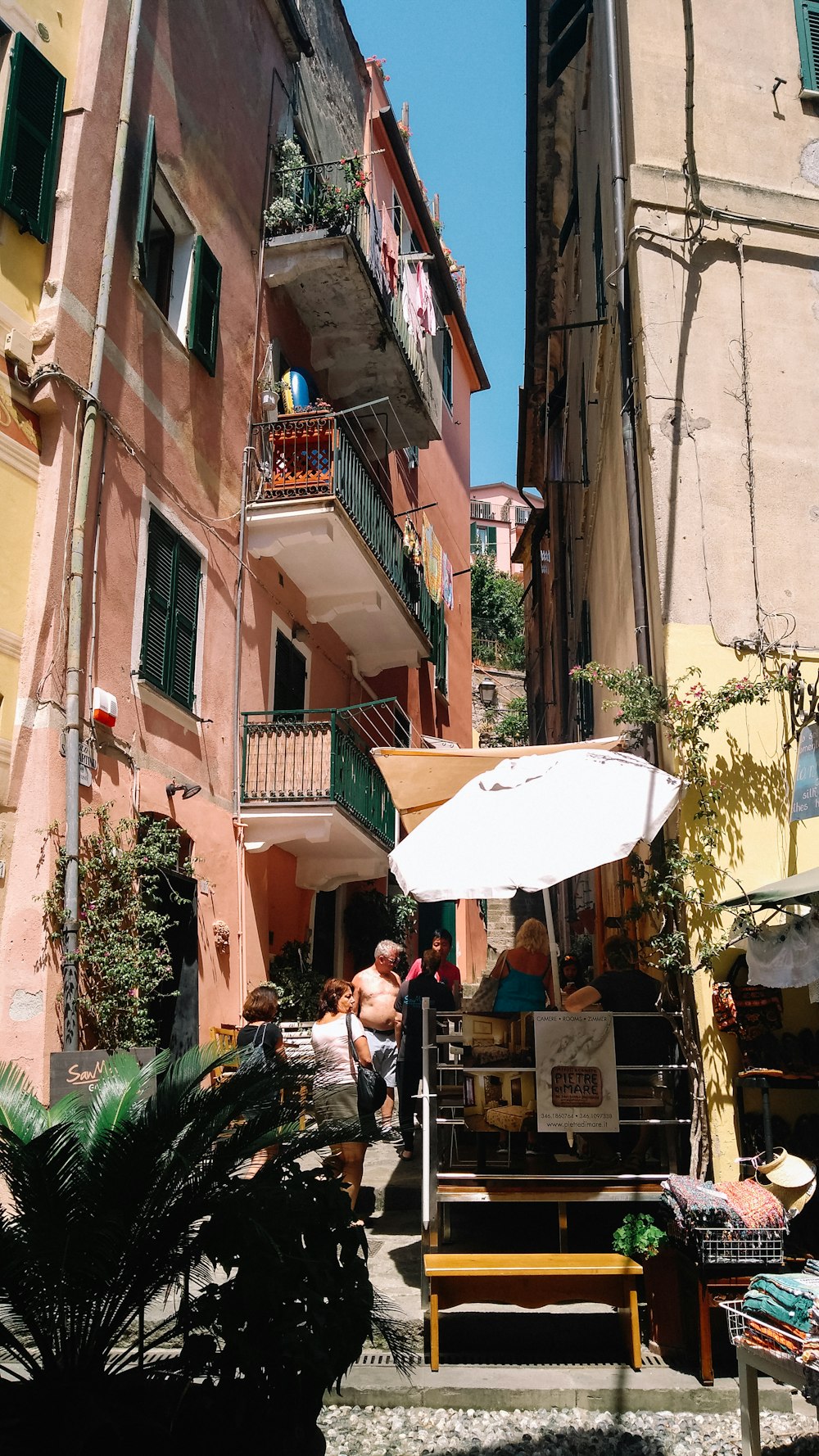 a group of people sitting outside of a building