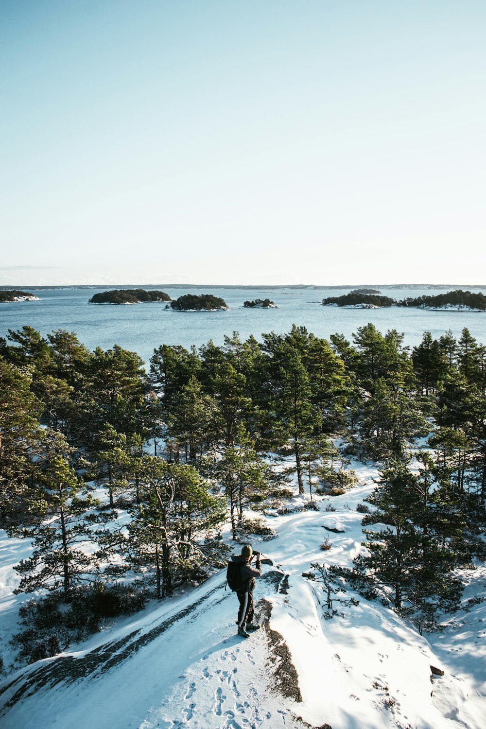 a person walking up a snow covered hill