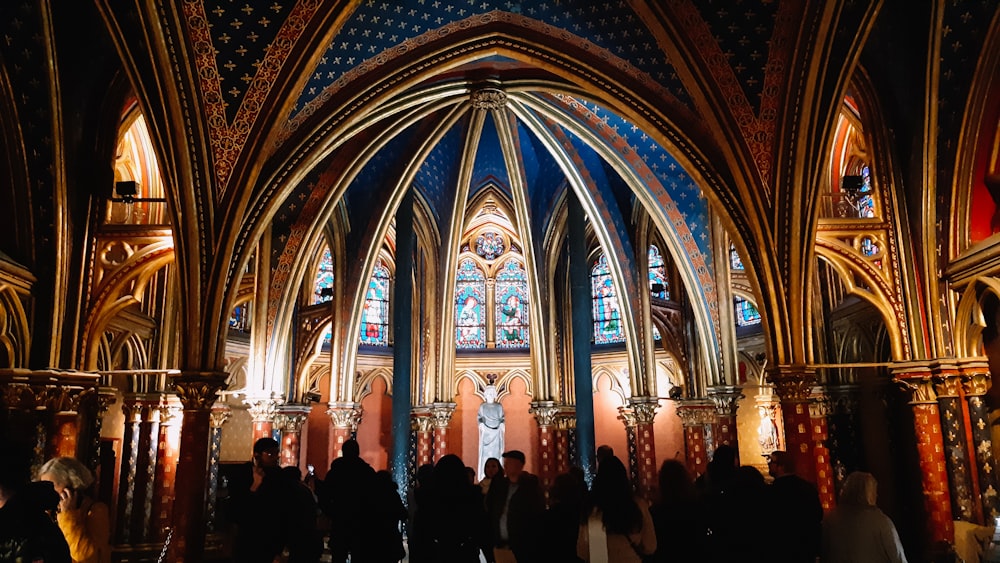 a group of people standing inside of a church