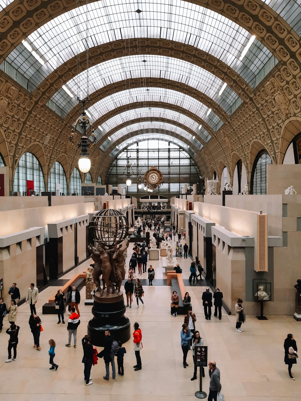 a group of people standing in a large building