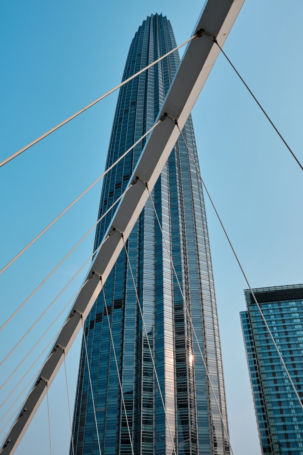 a very tall building towering over a city