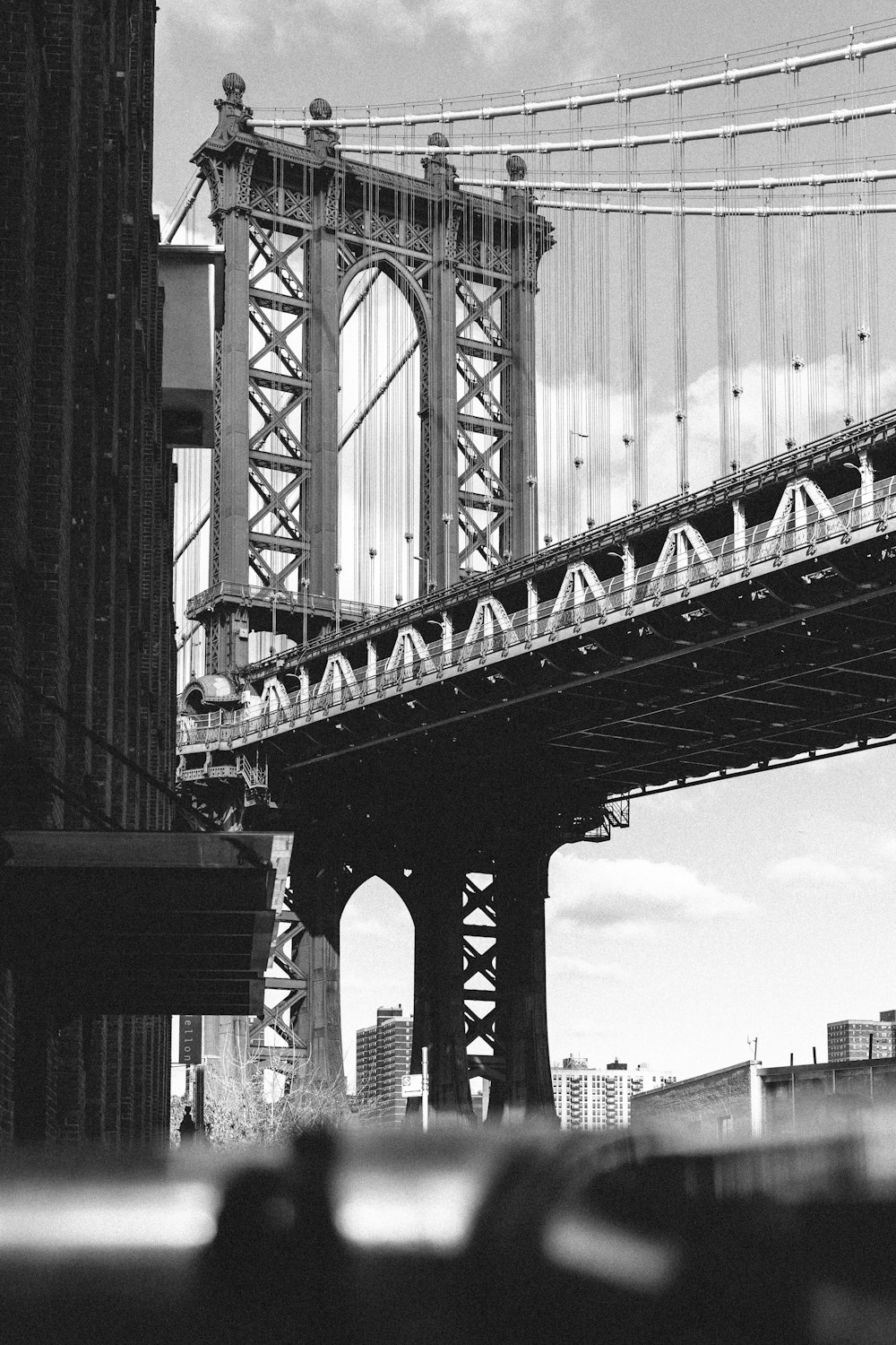 a black and white photo of the brooklyn bridge