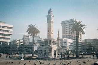 a large clock tower towering over a city
