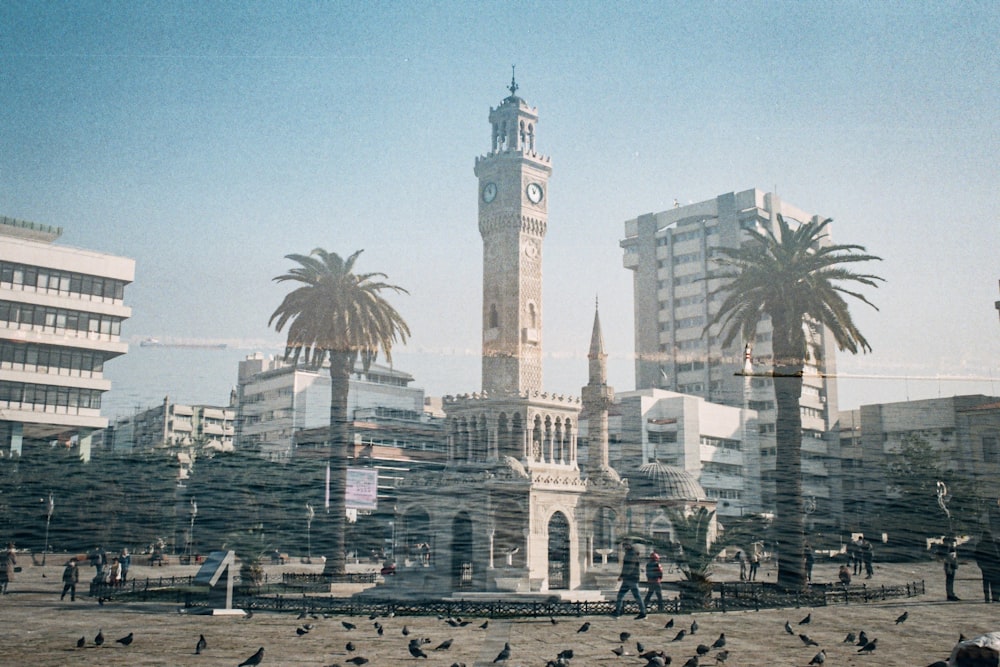 a large clock tower towering over a city