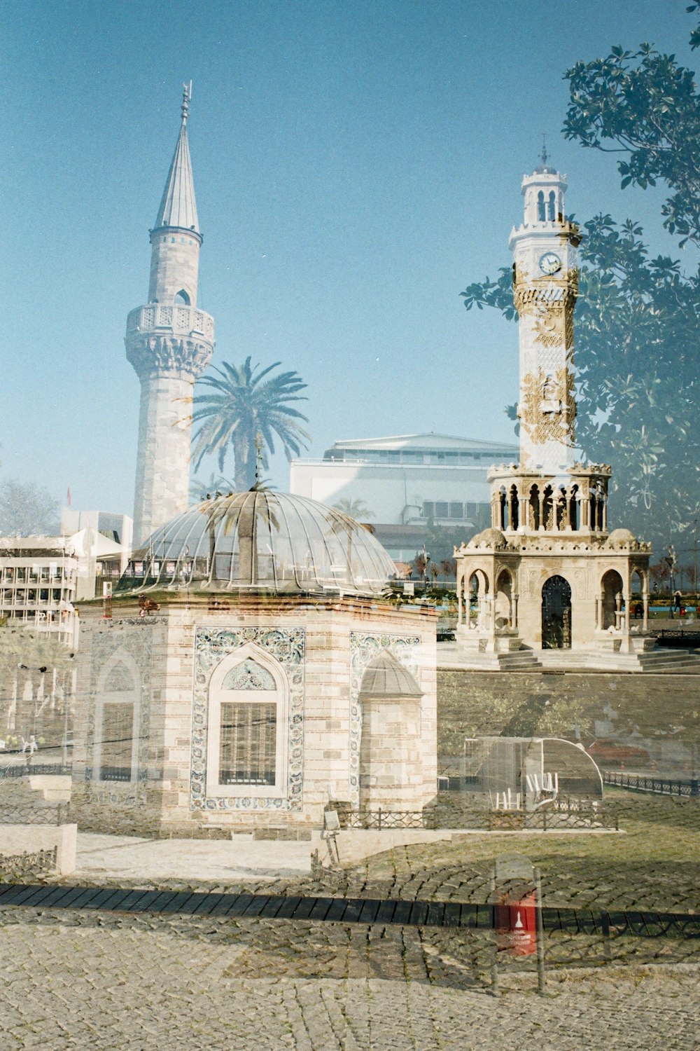 a large building with a clock tower in the background