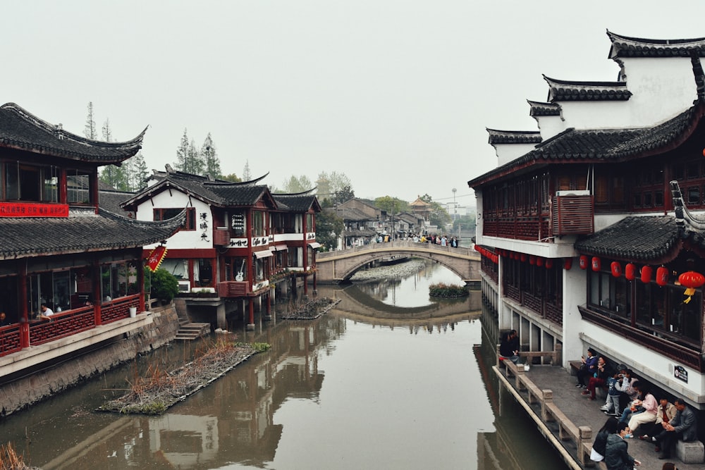 a river running through a city next to tall buildings