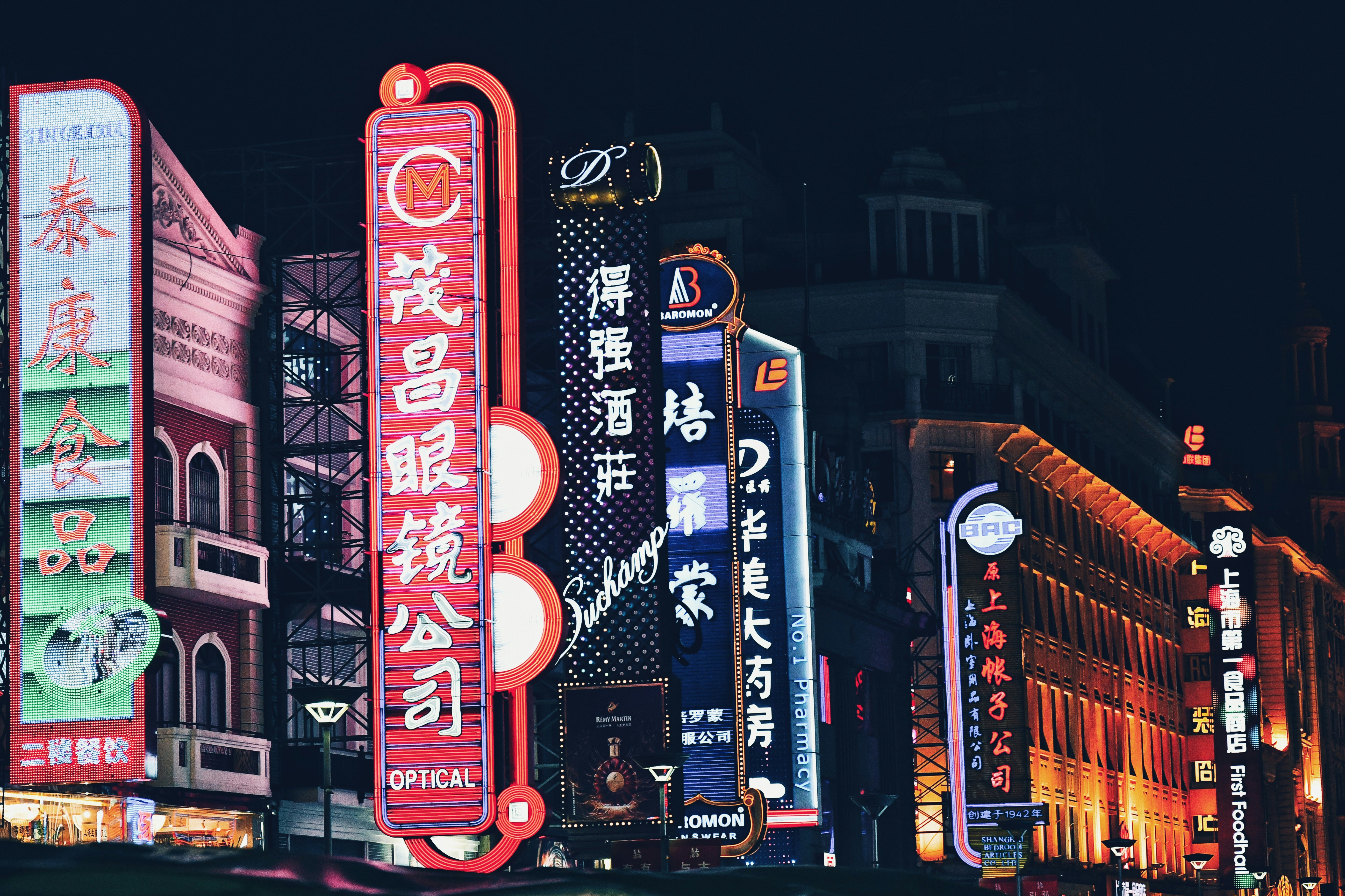 a city street filled with lots of tall buildings