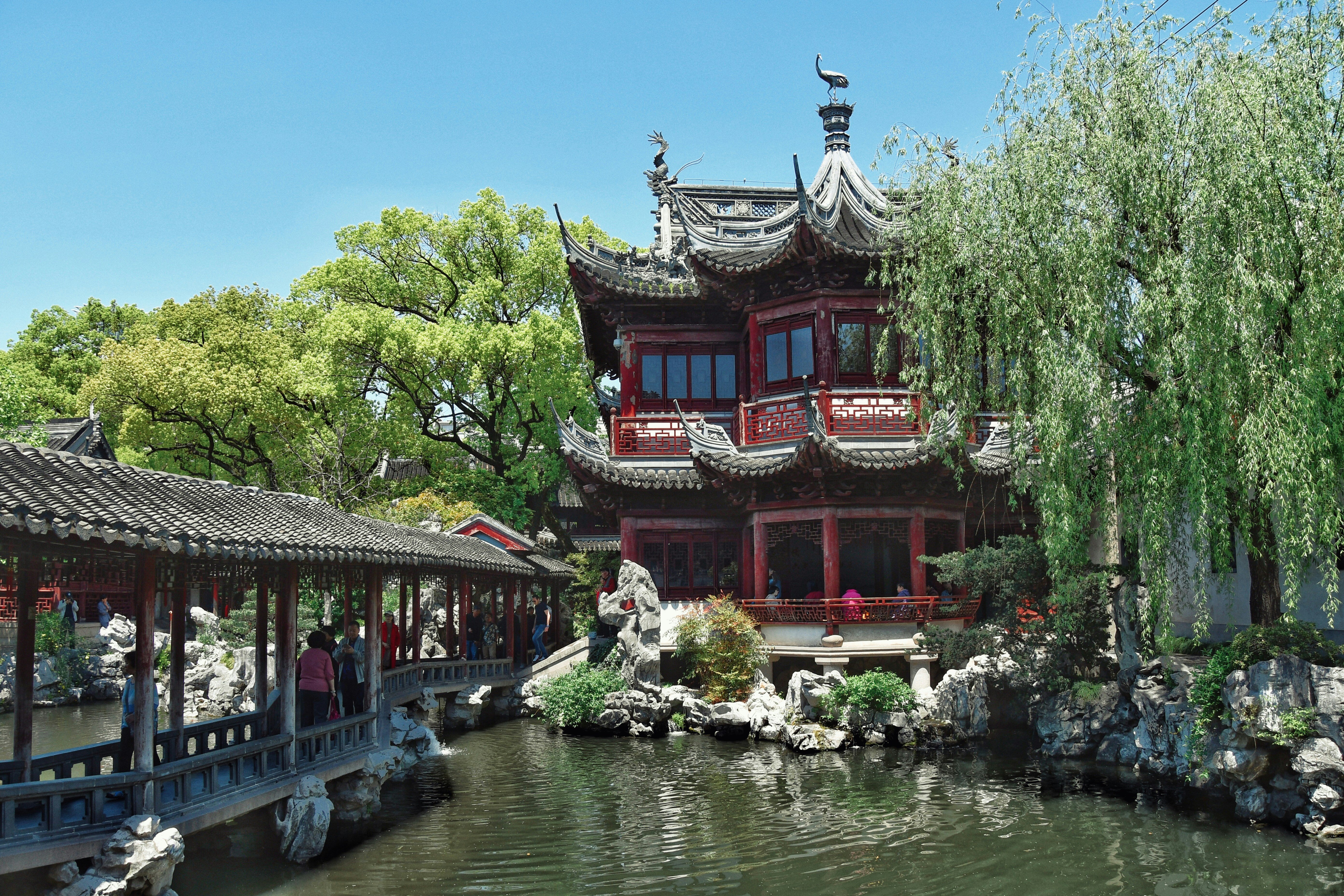 a building with a pond in front of it