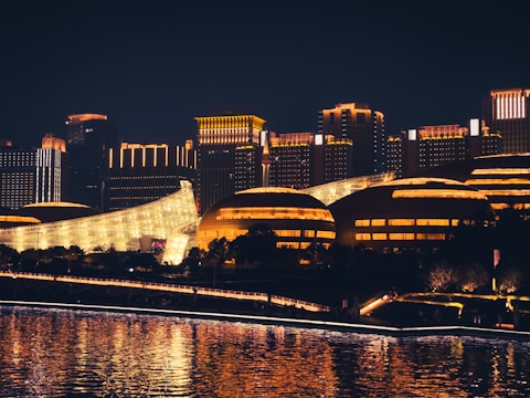 Abstract cityscape photo with glowing orange light reflections.