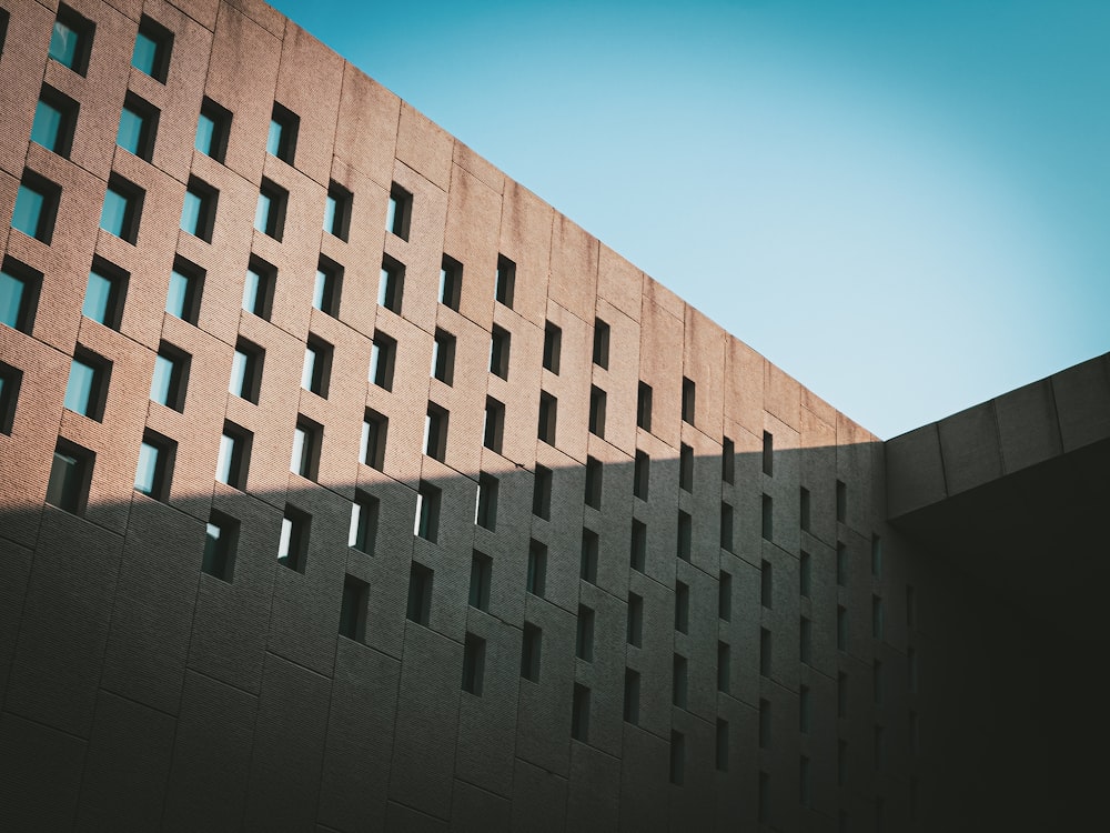 a tall building with many windows on the side of it