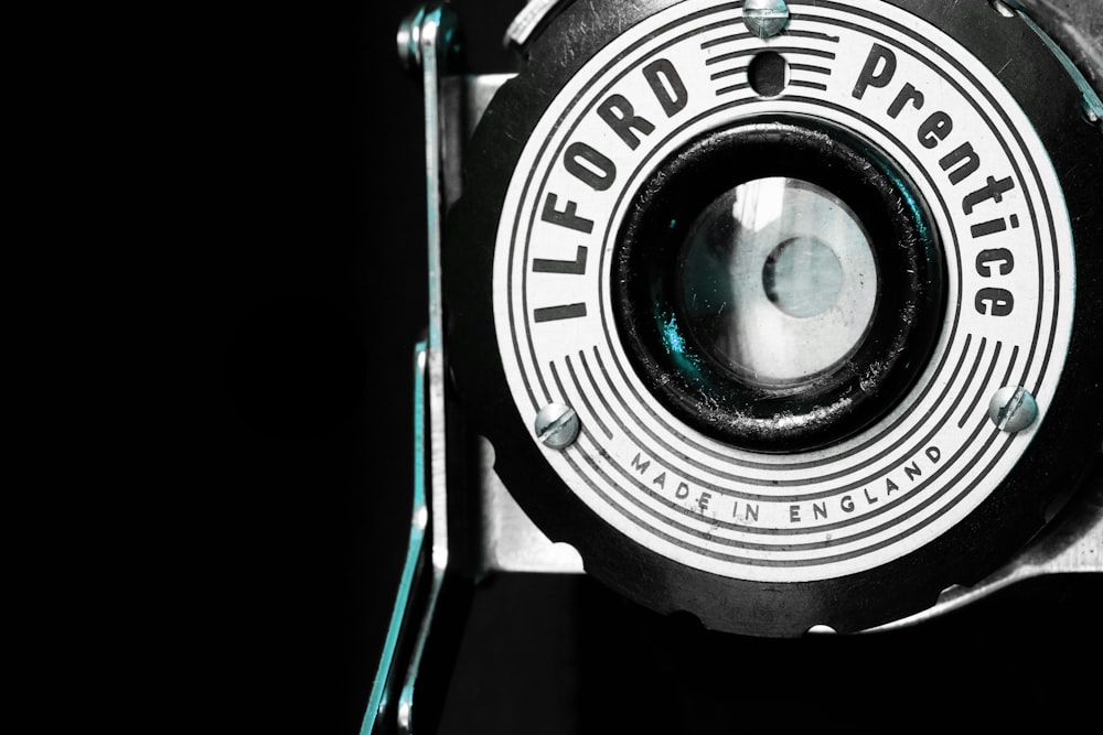 a close up of a camera with a black background