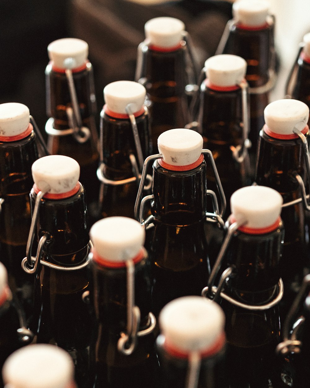 a bunch of brown bottles with white caps