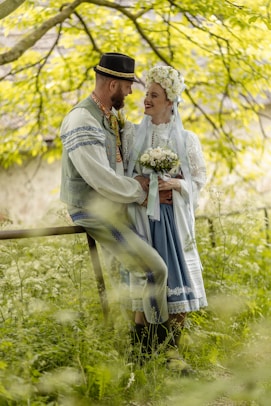 a man and a woman dressed in historical clothing