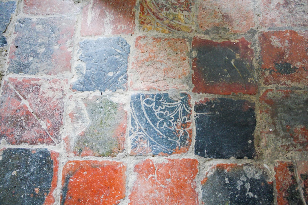 a close up of a tiled floor with a clock on it