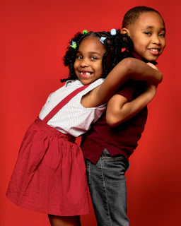 a couple of young girls standing next to each other
