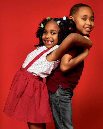 a couple of young girls standing next to each other