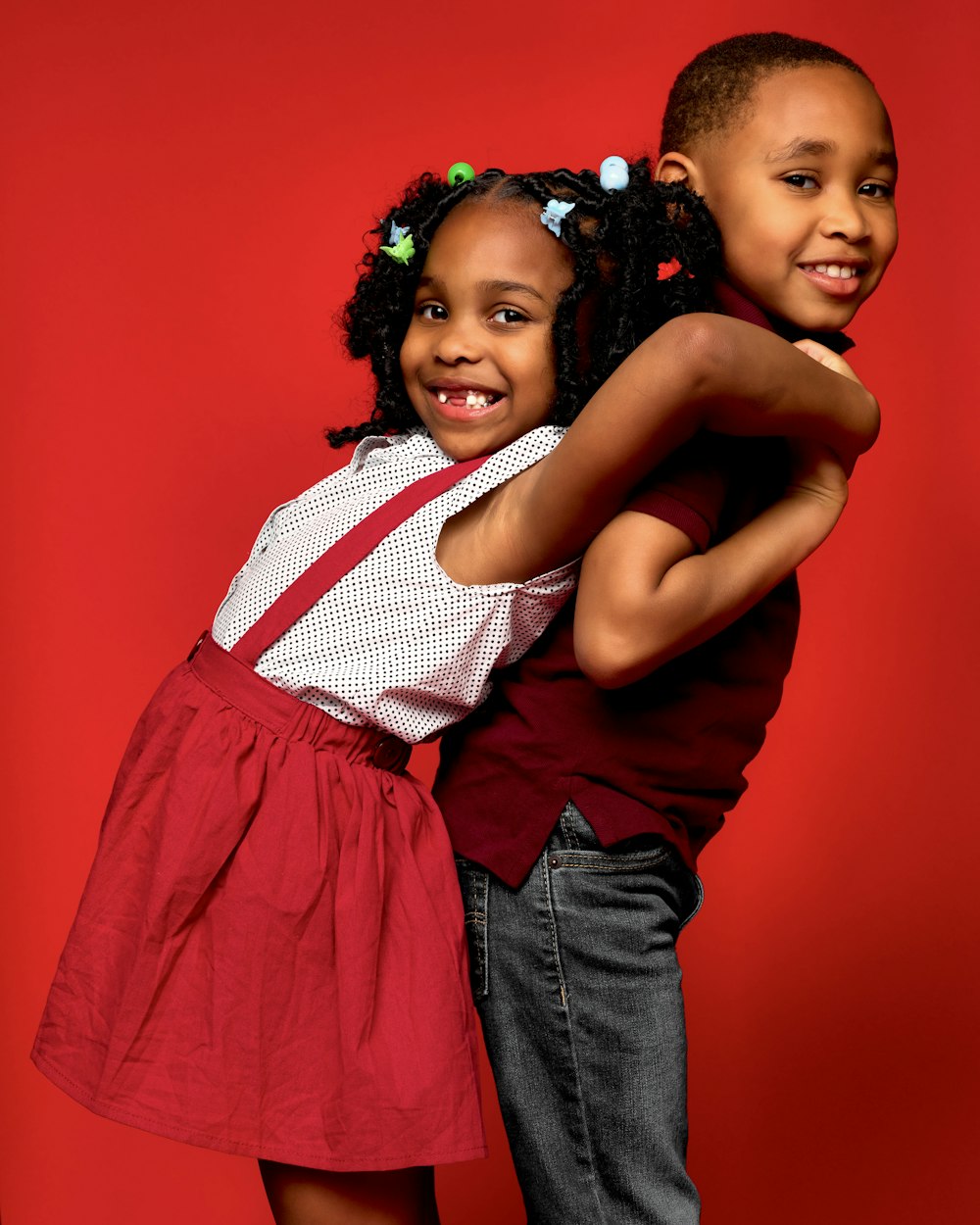 a couple of young girls standing next to each other