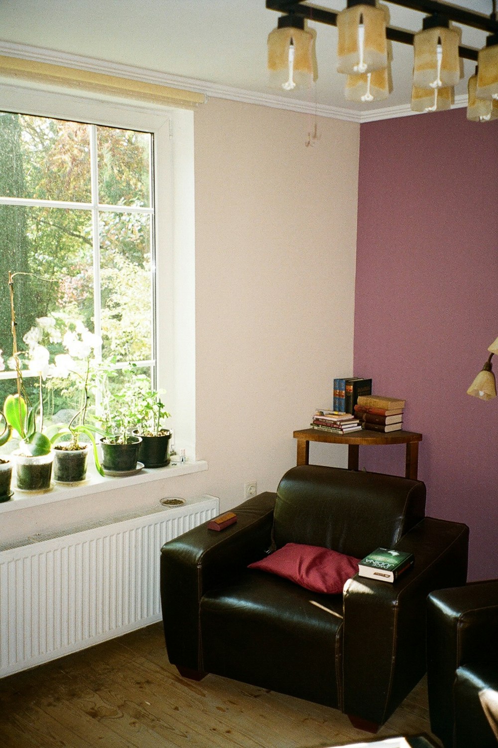 a living room filled with furniture and a large window