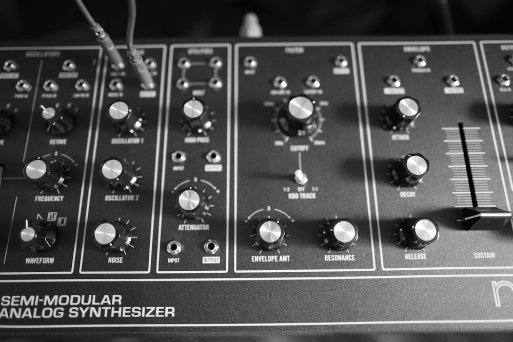a black and white photo of a sound board