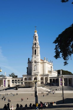 a large white building with a clock tower