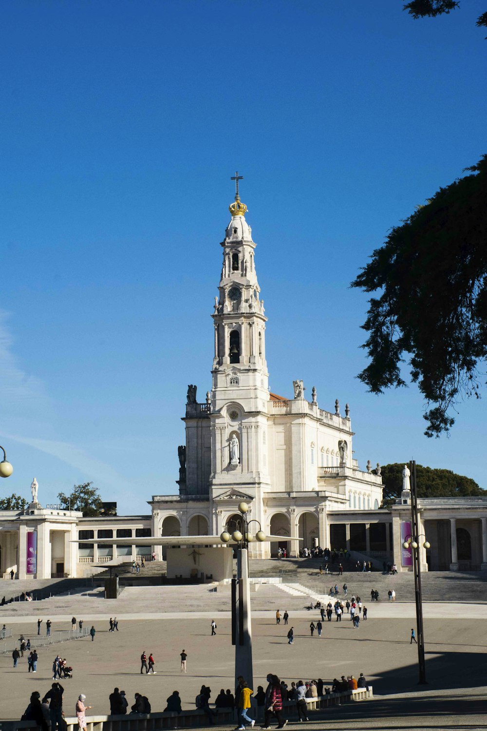 a large white building with a clock tower