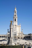 a large white building with a clock tower