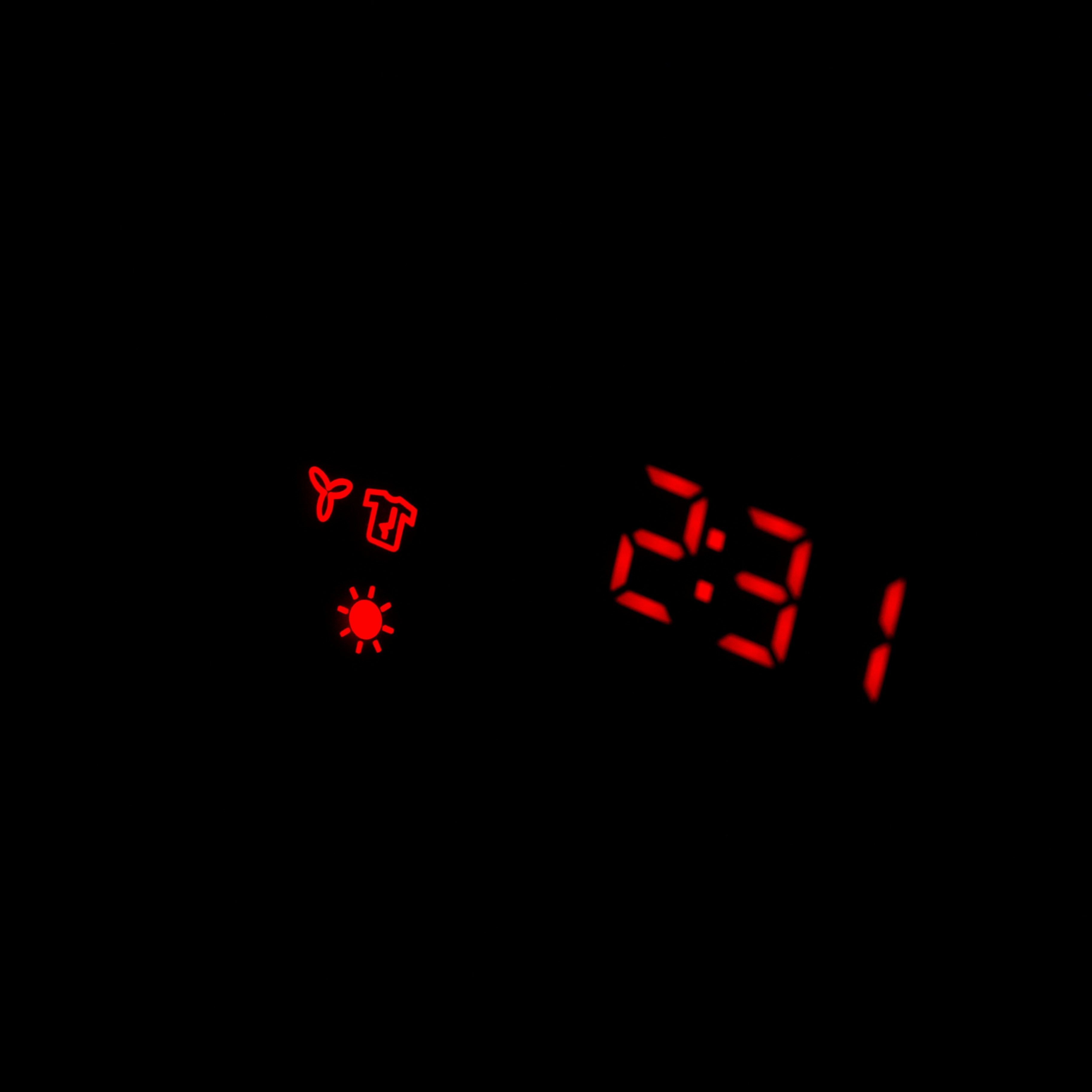 a digital clock with red numbers on a black background