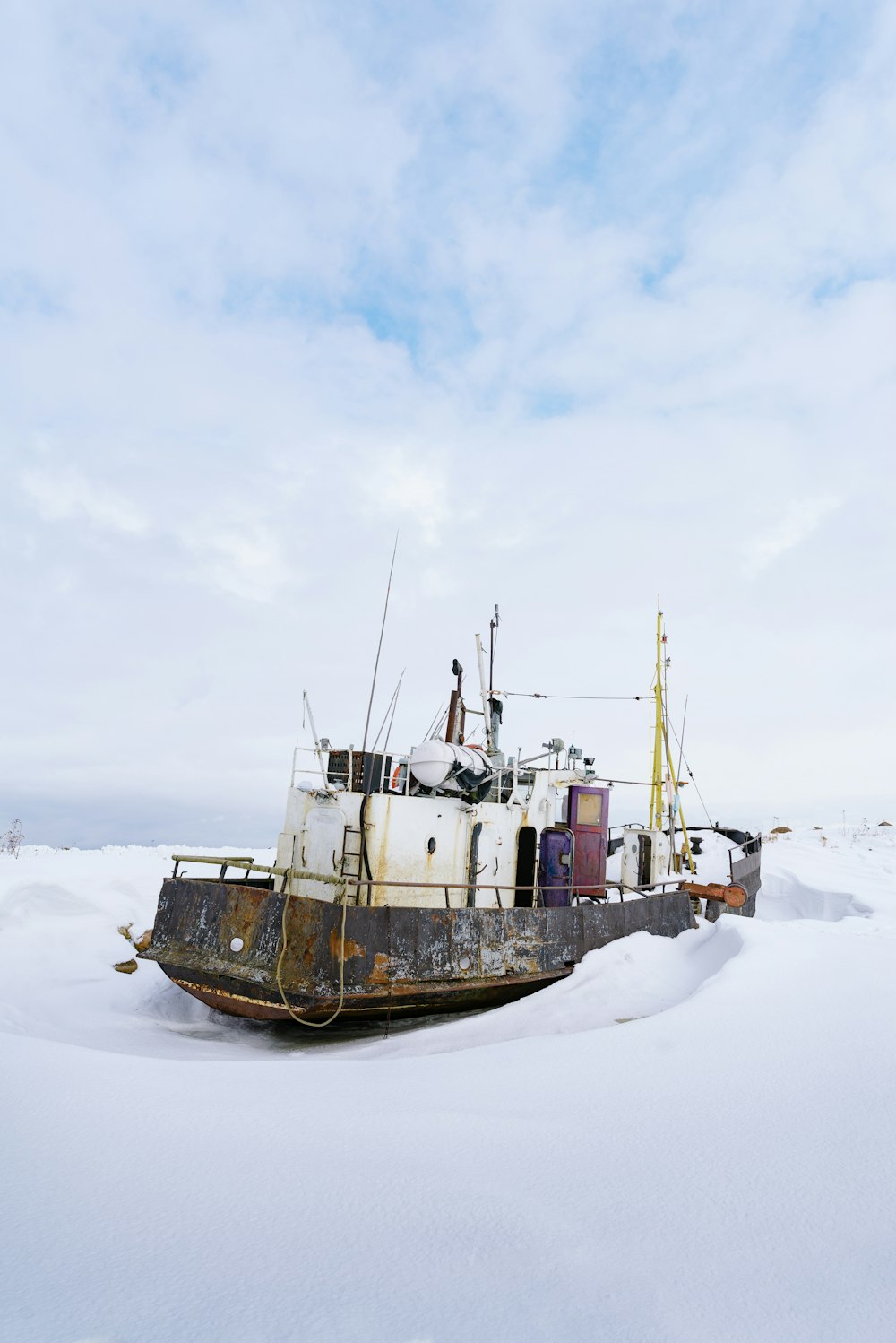 a boat that is sitting in the snow