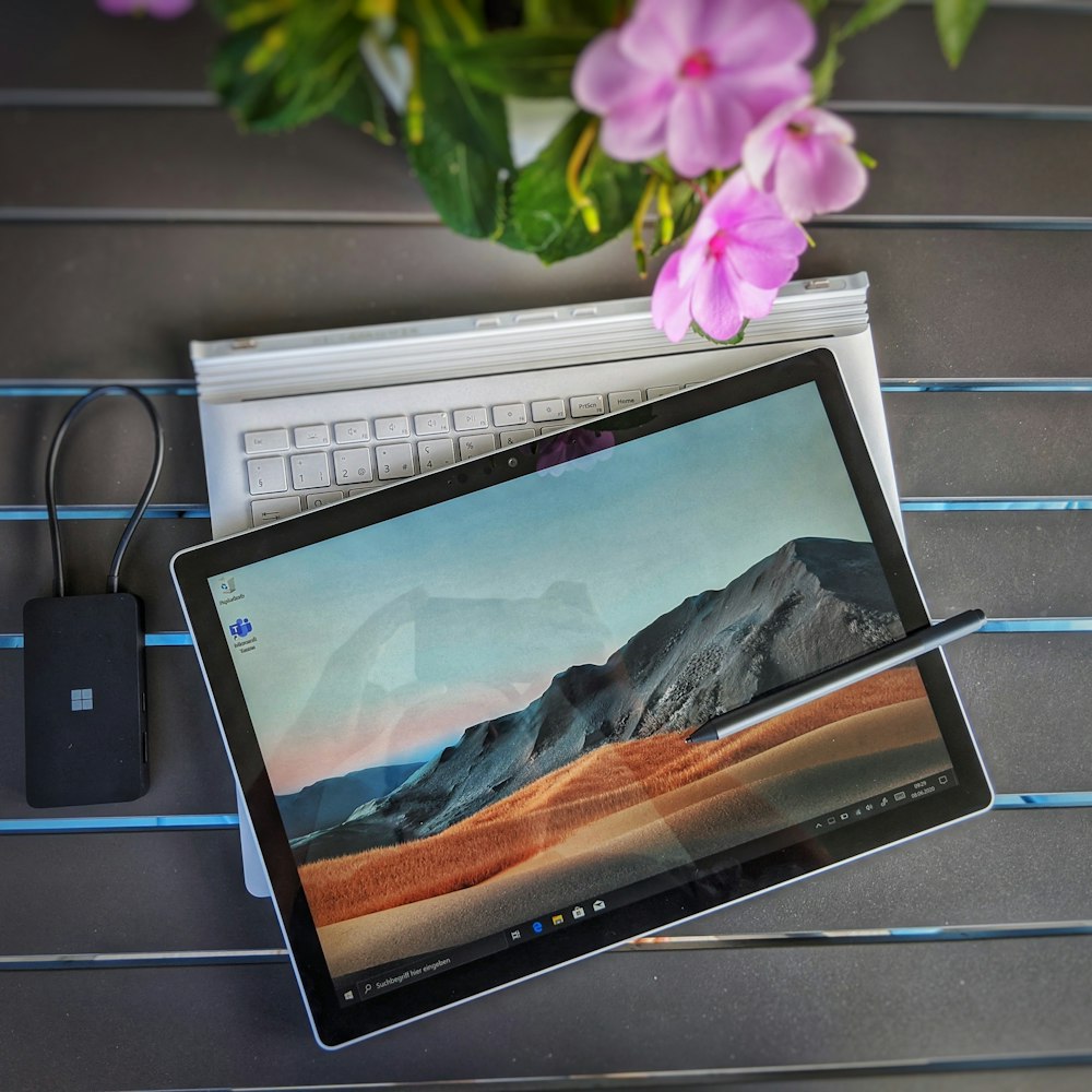 a laptop computer sitting on top of a table