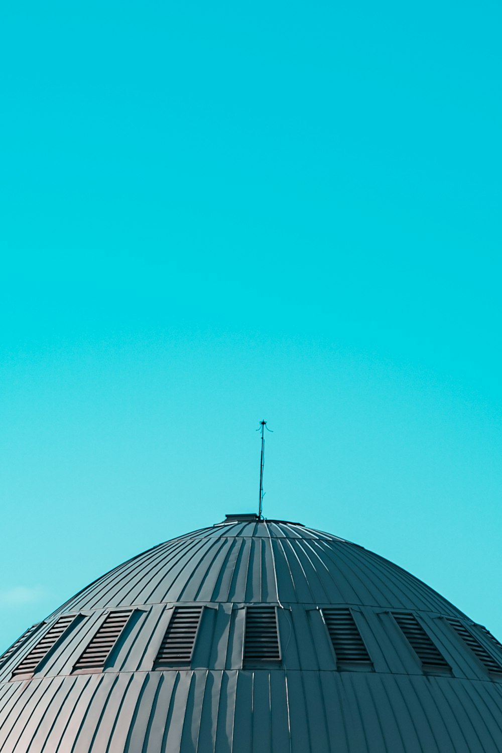 the top of a building with a clock on it