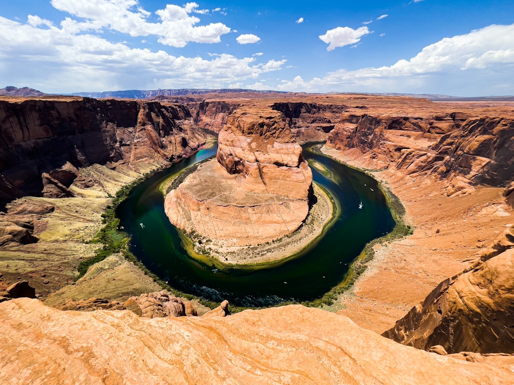 a river flowing through a canyon surrounded by mountains