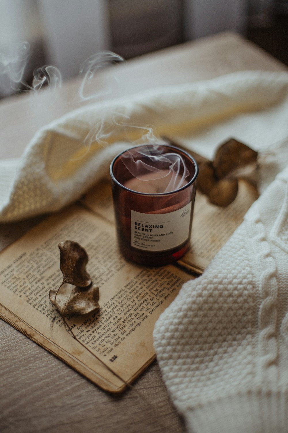 a candle sitting on top of an open book