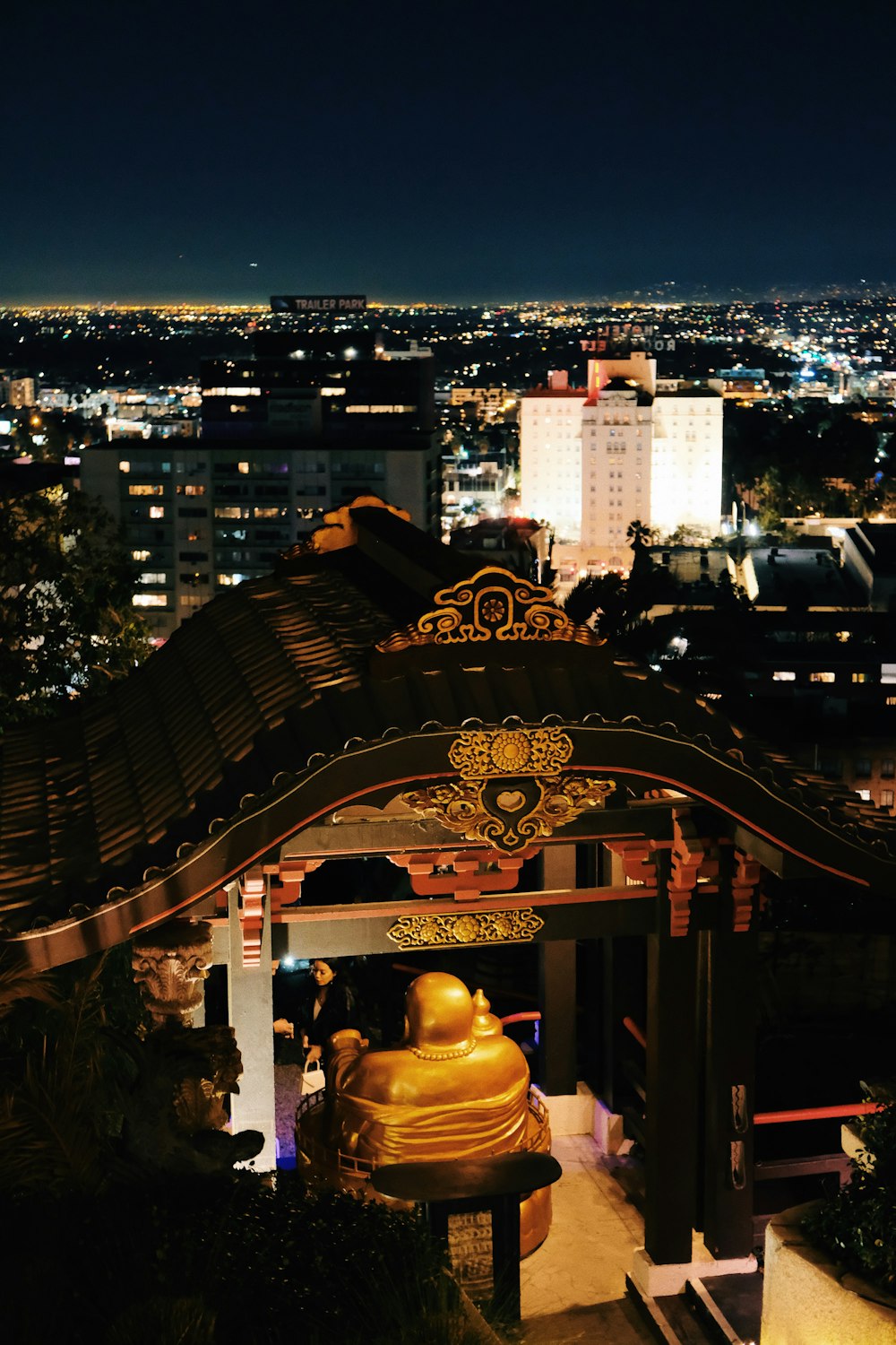 a view of a city at night from the top of a building