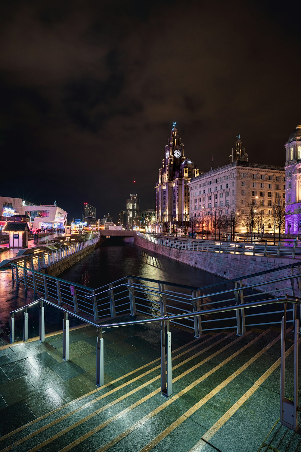 a view of a city at night from across the river