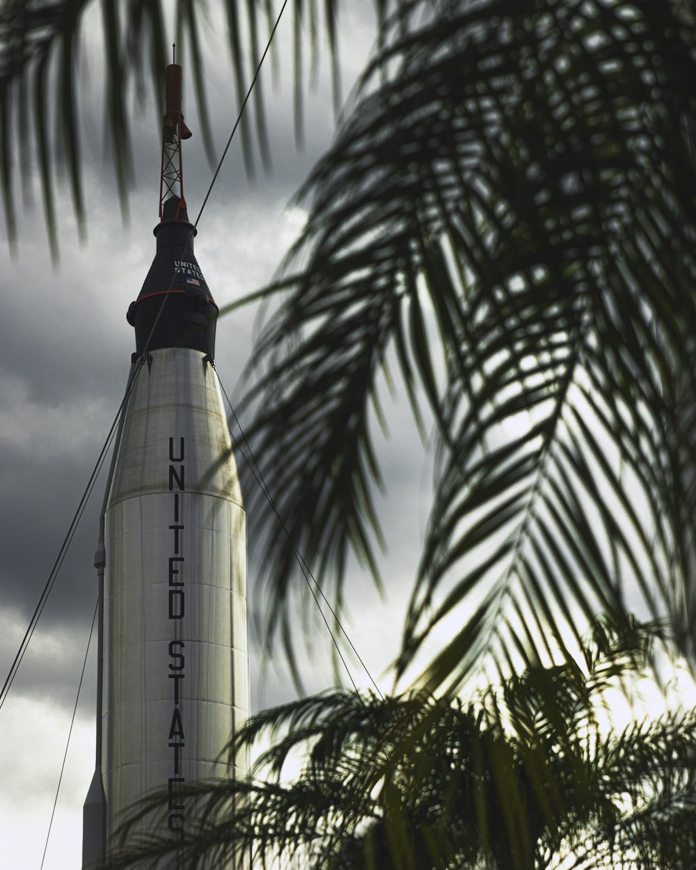 a large white rocket sitting on top of a building