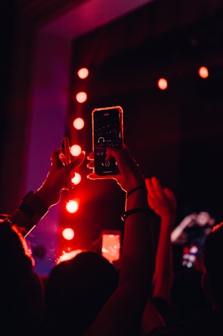 a person taking a video with a cell phone