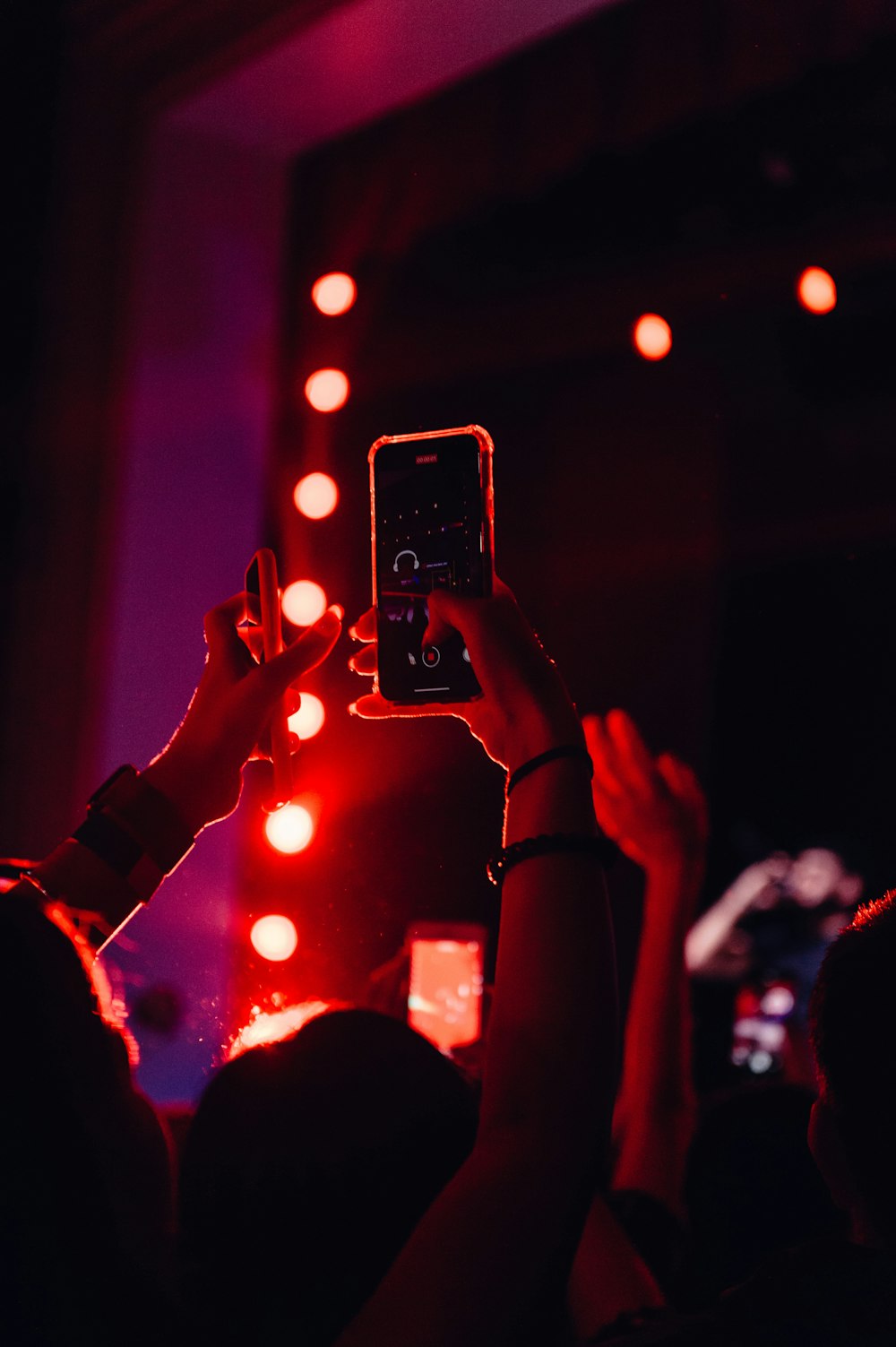 a person taking a picture with a cell phone