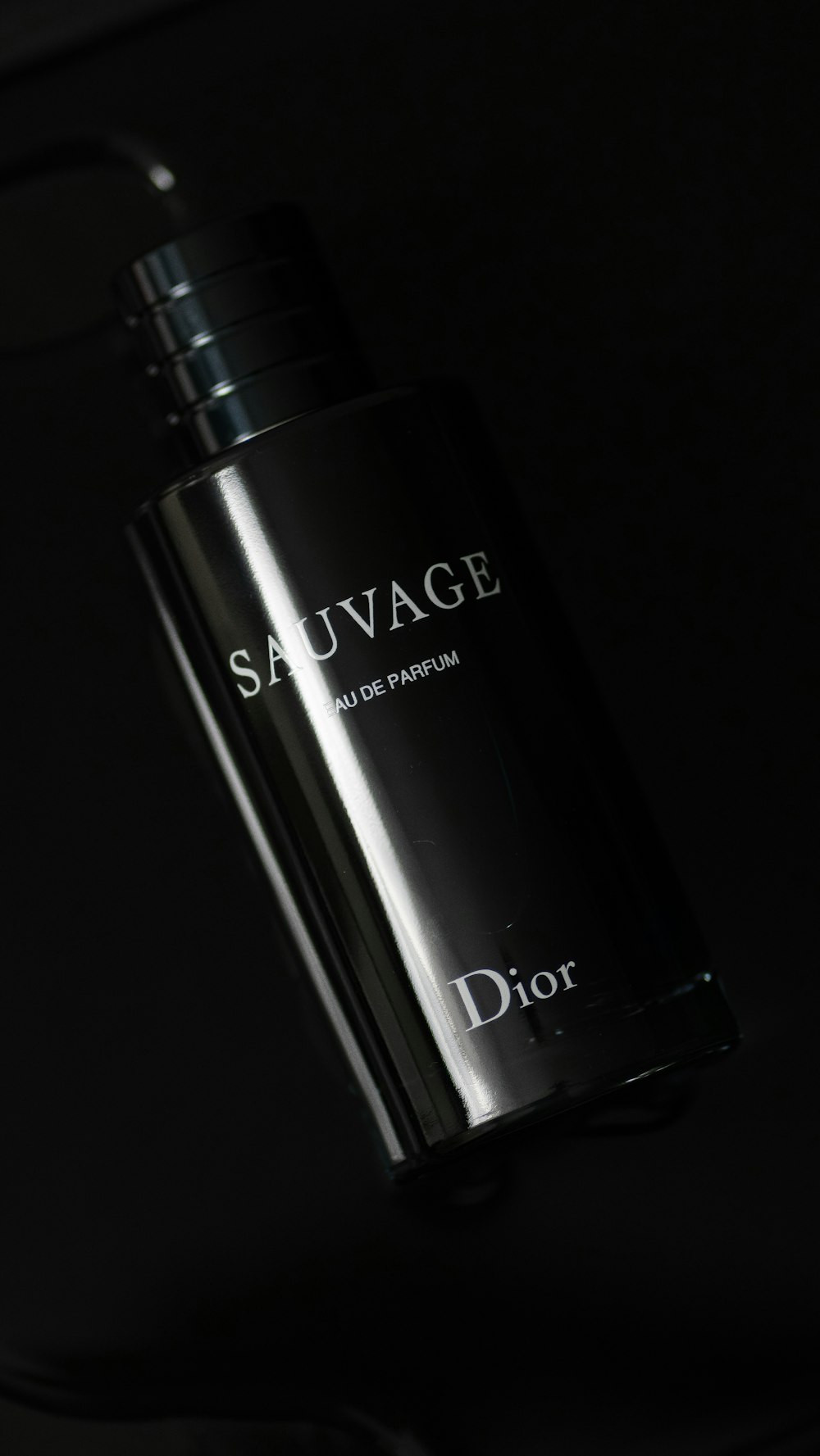 a bottle of dior sauvage on a table