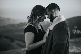 a black and white photo of a man and a woman