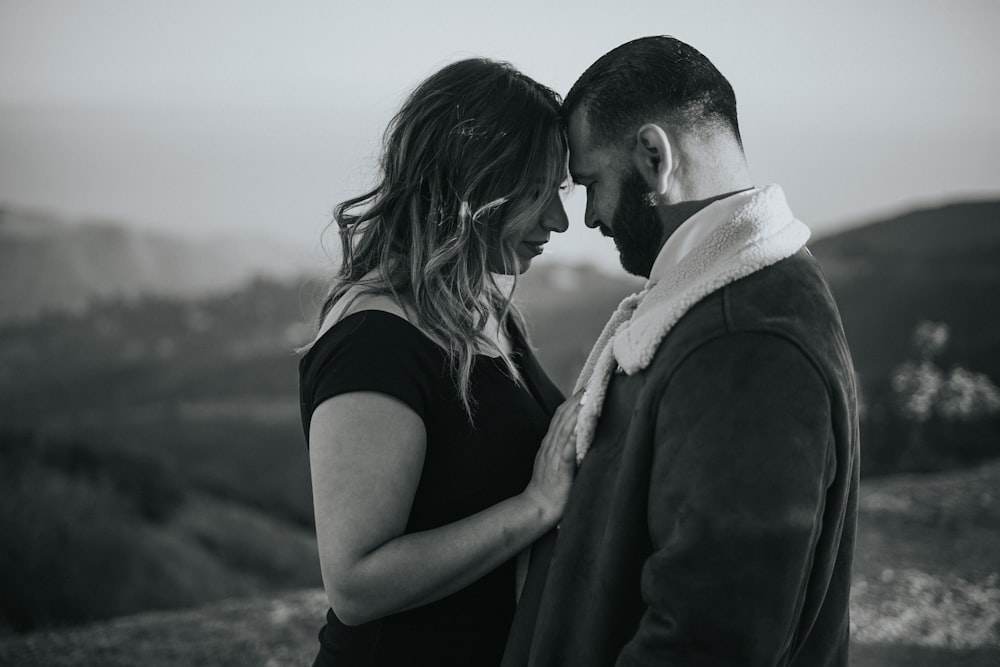 a black and white photo of a man and a woman