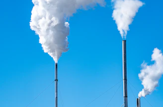 a smokestack emits from the top of a building