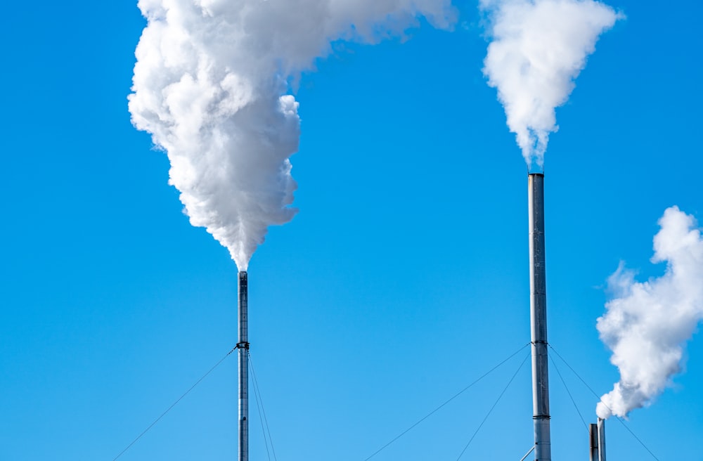 a smokestack emits from the top of a building