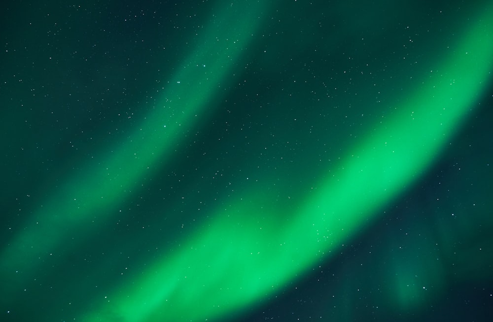 a bright green aurora bore in the night sky