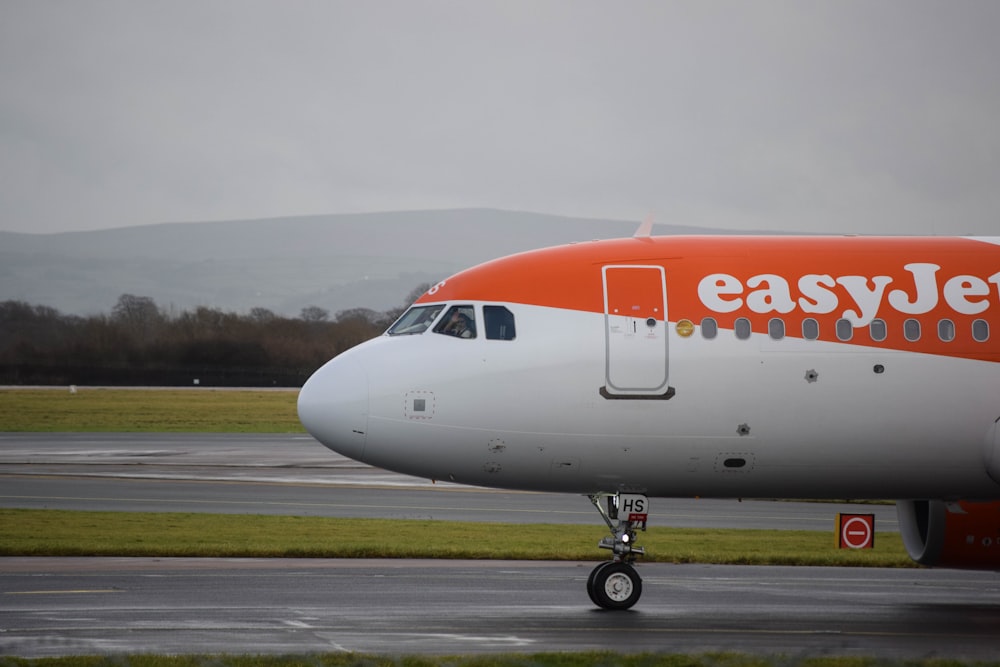 an easyjet airplane on the runway at an airport