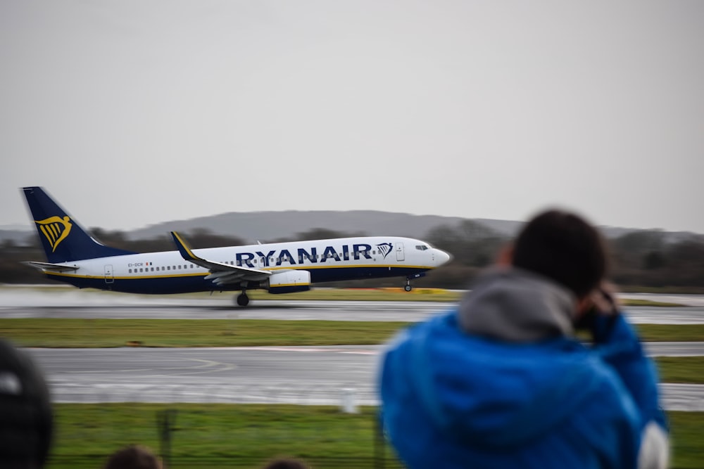 a large jetliner sitting on top of an airport runway